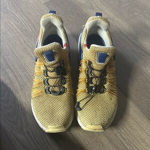 Nike shox gravity metallic gold
